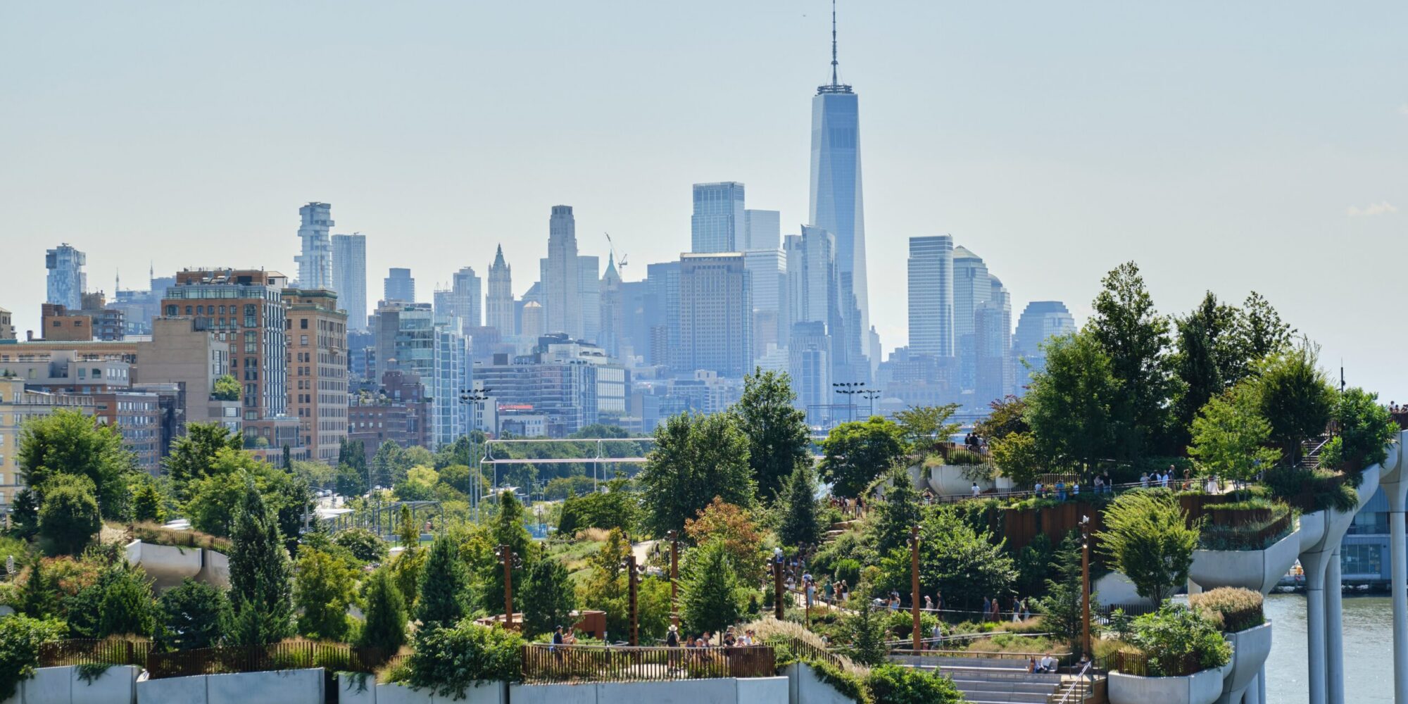 View of greenery against a New York City skyline